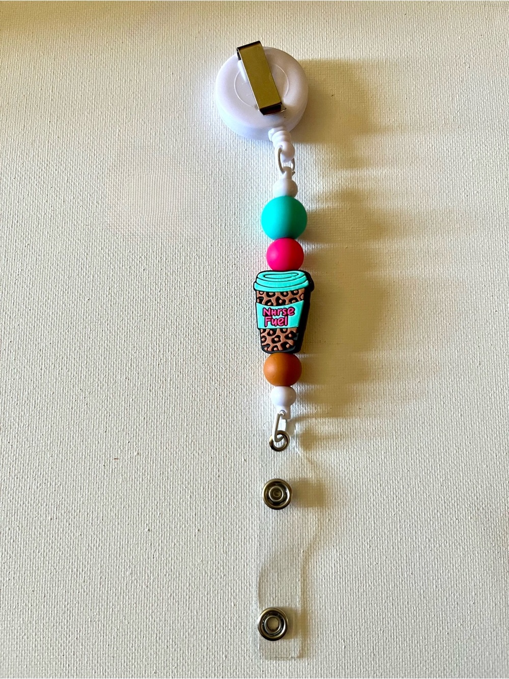 Beaded Badge Reel with Teal, Pink & Brown Accents